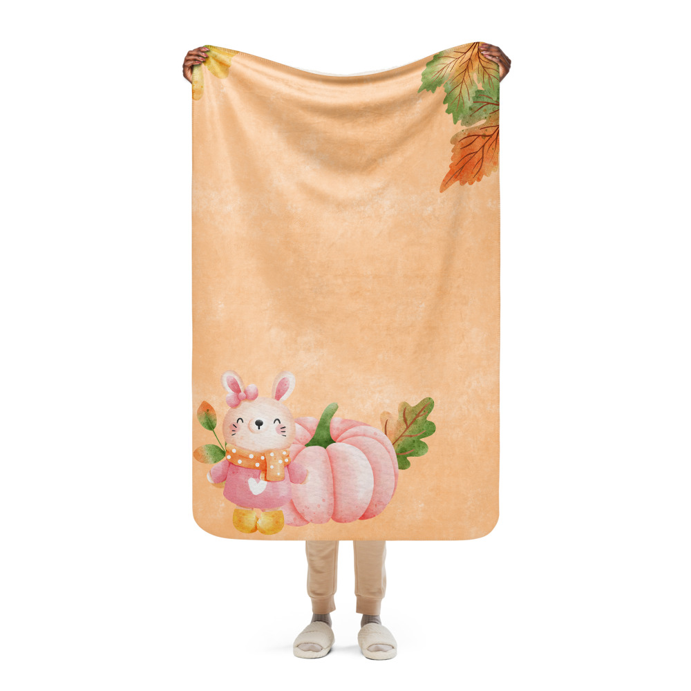 Manta mullida con conejita y calabaza en fondo color salmón con hojas de otoño - Imagen 8
