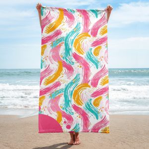 Toalla de playa con ondas coloridas en rosas, amarillos y azules